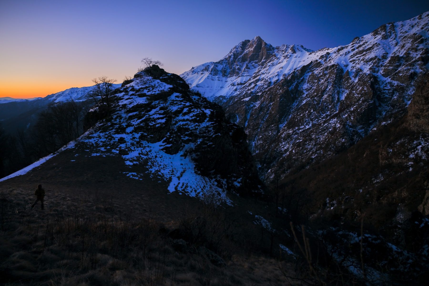 Walker on a ridge at dawn